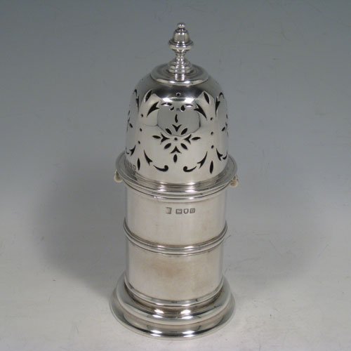    Antique Edwardian sterling silver sugar caster, in the George I style, having a round straight-sided body, with hand-pierced bayonet fit lid and finial, sitting on a collet foot. Made by the Pairpoint Brothers of London in 1909. Height 18 cms (7 inches), diameter at base 7.5 cms (3 inches). Weight approx. 298g (9.6 troy ounces).