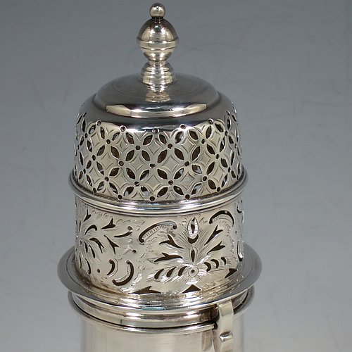 An Antique Edwardian Sterling Silver large sugar caster in a George II style, having a bellied body with hand-chased lower fluting, with applied reeded borders, a bayonet-fit pull-off hand-pierced lid with cast finial, and sitting on a pedestal foot. Made by Nathan & Hayes of Chester in 1904. The dimensions of this fine hand-made antique silver sugar caster are height 20.5 cms (8 inches), width 8 cms (3 inches), and it weighs approx. 328g (10.6 troy ounces).    