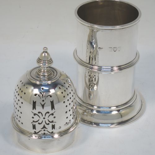 A very handsome Antique Victorian Sterling Silver sugar caster, in a Queen Anne lighthouse style, having a plain round straight-sided body with applied reeded borders, a hand-pierced bayonet fit lid and a cast finial, and all sitting on a round collet foot. Made by Sibray, Hall and Co., of London in 1894. The dimensions of this fine hand-made antique silver sugar caster are height 16.5 cms (6.5 inches), diameter at base 8 cms (3 inches), and it weighs approx. 253g (8.2 troy ounces).   