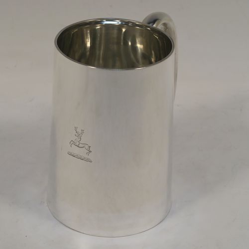 A very handsome Antique Sterling Silver pint mug or tankard, having a plain round body with straight tapering sides, a plain loop side-handle, and all sitting on a flat base. This elegant silver tankard or mug was made by Carrington and Co., of London in 1918. The dimensions of this fine hand-made antique silver pint mug are height 12 cms (4.75 inches), diameter at top 7.5 cms (3 inches), and it weighs approx. 281g (9 troy ounces).   