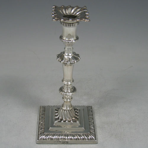 Sterling silver Edwardian taperstick made by Johnson, Walker, & Tolhusrt of London in 1909. Height 16 cms.