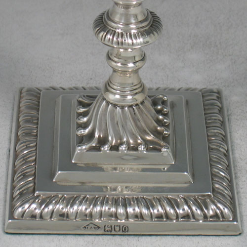 Sterling silver Edwardian taperstick made by Johnson, Walker, & Tolhusrt of London in 1909. Height 16 cms.