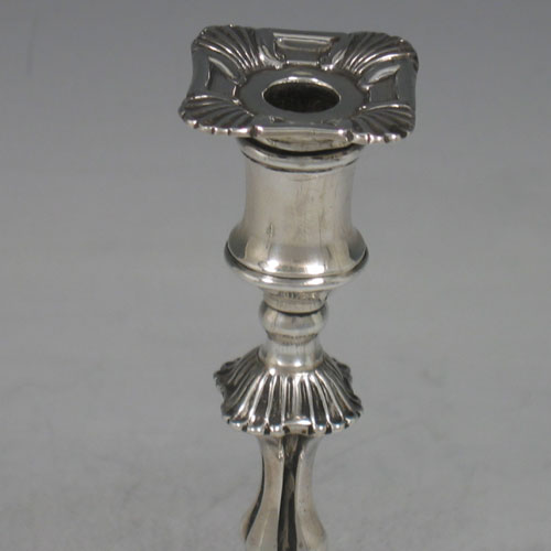 Antique Victorian sterling silver pair of tapersticks made by Thomas Bradbury of London in 1898. Height 14 cms.