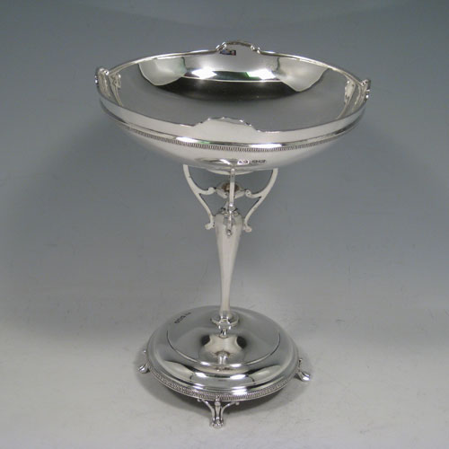 Sterling silver Art Nouveau tazza dish, having a round body with applied gadroon band and shaped border, sitting on a pedestal foot with four holding arms, and a base with gadroon border and four cast feet. Made by Pearce and Sons of Sheffield in 1918. The dimensions of this fine hand-made silver tazza dish are height 18 cms (7 inches), diameter 14 cms (5.5 inches), and it weighs approx. 292g (9.4 troy ounces).   