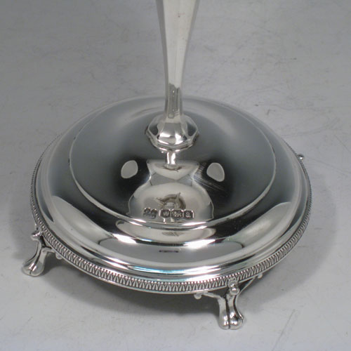 Sterling silver Art Nouveau tazza dish, having a round body with applied gadroon band and shaped border, sitting on a pedestal foot with four holding arms, and a base with gadroon border and four cast feet. Made by Pearce and Sons of Sheffield in 1918. The dimensions of this fine hand-made silver tazza dish are height 18 cms (7 inches), diameter 14 cms (5.5 inches), and it weighs approx. 292g (9.4 troy ounces).   