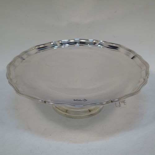 A handsome and heavy Sterling Silver tazza dish, having a round body with an applied and shaped reeded border, and sitting on a round stepped pedestal foot. Made by Z. Barraclough and Sons Ltd., of Sheffield in 1932. The dimensions of this fine hand-made silver tazza dish are height 8 cms (3 inches), diameter 25.5 cms (10 inches), and it weighs approx. 780g (25 troy ounces).  