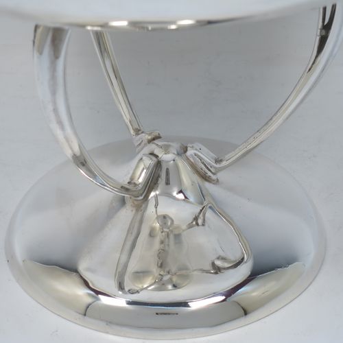 A pretty Art Nouveau style Antique Edwardian Sterling Silver tazza dish or bowl, having a plain round bowl body, sitting on a plain round pedestal foot with three scrolled supports. Made by Aspreys 
and Co. Ltd., of London in 1910. The dimensions of this fine hand-made antique silver tazza bowl or dish are height 17.5 cms (7 inches), diameter of bowl 23 cms (9 inches), and it weighs approx. 719g (23 troy ounces).   