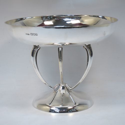 A pretty Art Nouveau style Antique Edwardian Sterling Silver tazza dish or bowl, having a plain round bowl body, sitting on a plain round pedestal foot with three scrolled supports. Made by Aspreys 
and Co. Ltd., of London in 1910. The dimensions of this fine hand-made antique silver tazza bowl or dish are height 17.5 cms (7 inches), diameter of bowl 23 cms (9 inches), and it weighs approx. 719g (23 troy ounces).   