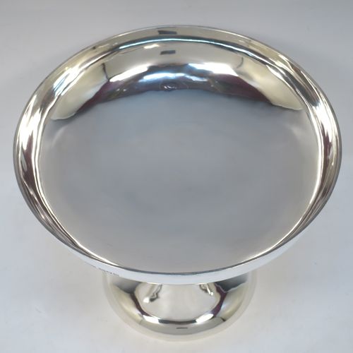 A pretty Art Nouveau style Antique Edwardian Sterling Silver tazza dish or bowl, having a plain round bowl body, sitting on a plain round pedestal foot with three scrolled supports. Made by Aspreys 
and Co. Ltd., of London in 1910. The dimensions of this fine hand-made antique silver tazza bowl or dish are height 17.5 cms (7 inches), diameter of bowl 23 cms (9 inches), and it weighs approx. 719g (23 troy ounces).   