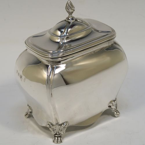 A very handsome Antique Sterling Silver tea caddy box in a Bon-bonier style, having a rectangular  bellied body with hand-chased fluted corners, a hinged domed lid with a cast swirl finial, a gold-gilt interior, and all sitting on four cast lions-paw feet. This elegant antique silver tea caddy box was made by S. Blanckensee and Sons of Chester in 1921. The dimensions of this fine hand-made antique silver tea caddy box are height 11 cms (4.3 inches), depth 6.5 cms (2.6 inches), width 9.5 cms (3.75 inches), and it weighs approx. 186g (6 troy ounces).   