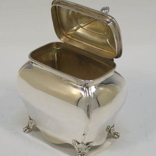 A very handsome Antique Sterling Silver tea caddy box in a Bon-bonier style, having a rectangular  bellied body with hand-chased fluted corners, a hinged domed lid with a cast swirl finial, a gold-gilt interior, and all sitting on four cast lions-paw feet. This elegant antique silver tea caddy box was made by S. Blanckensee and Sons of Chester in 1921. The dimensions of this fine hand-made antique silver tea caddy box are height 11 cms (4.3 inches), depth 6.5 cms (2.6 inches), width 9.5 cms (3.75 inches), and it weighs approx. 186g (6 troy ounces).   