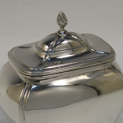 A very handsome Antique Sterling Silver tea caddy box in a Bon-bonier style, having a rectangular  bellied body with hand-chased fluted corners, a hinged domed lid with a cast swirl finial, a gold-gilt interior, and all sitting on four cast lions-paw feet. This elegant antique silver tea caddy box was made by S. Blanckensee and Sons of Chester in 1921. The dimensions of this fine hand-made antique silver tea caddy box are height 11 cms (4.3 inches), depth 6.5 cms (2.6 inches), width 9.5 cms (3.75 inches), and it weighs approx. 186g (6 troy ounces).   