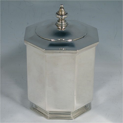 An Antique Edwardian Sterling Silver tea caddy box, having a plain straight-sided octagonal body, a hinged lid with cast urn-shape finial, and all sitting on a collet foot. Made by Elkington & Co., of London in 1908. The dimensions of this fine hand-made antique silver tea caddy box are height 13 cms (5 inches), width 9 cms (3.5 inches), and it weighs approx. 312g (10 troy ounces).    