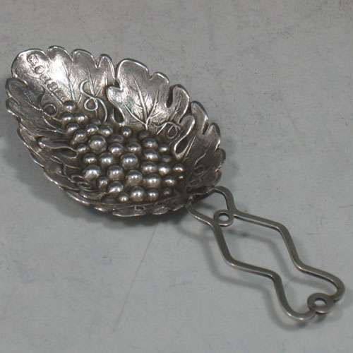 Antique Victorian sterling silver hand-chased tea caddy spoon with grape-vine detail. Made by Francis Clark of Birmingham in 1845. Length 9 cms.