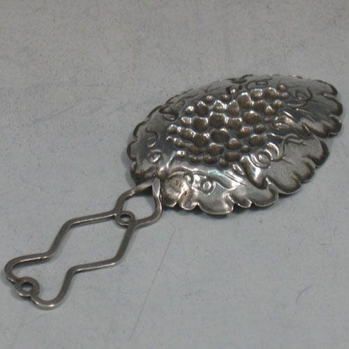 Antique Victorian sterling silver hand-chased tea caddy spoon with grape-vine detail. Made by Francis Clark of Birmingham in 1845. Length 9 cms.