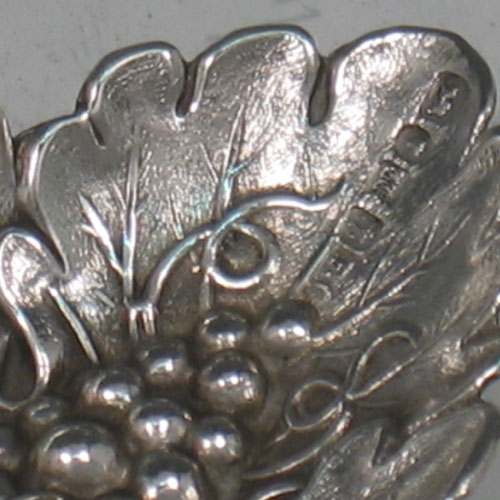 Antique Victorian sterling silver hand-chased tea caddy spoon with grape-vine detail. Made by Francis Clark of Birmingham in 1845. Length 9 cms.