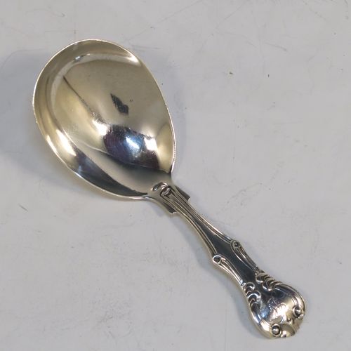 A pretty Antique Victorian Sterling Silver tea caddy spoon, having a double-struck fancy pattern handle, and a plain oval bowl. This beautiful antique silver tea caddy spoon was made by Henry Holland of London in 1860. The dimensions of this fine hand-made antique silver tea caddy spoon are length 10 cms (4 inches), width across bowl 4 cms (1.5 inches), and it weighs approx. 20g (0.65 troy ounces).   