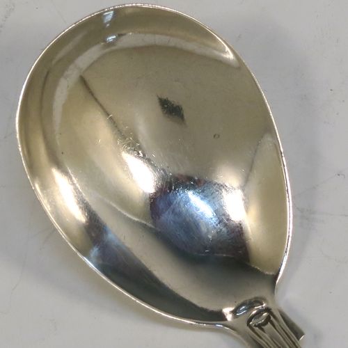 A pretty Antique Victorian Sterling Silver tea caddy spoon, having a double-struck fancy pattern handle, and a plain oval bowl. This beautiful antique silver tea caddy spoon was made by Henry Holland of London in 1860. The dimensions of this fine hand-made antique silver tea caddy spoon are length 10 cms (4 inches), width across bowl 4 cms (1.5 inches), and it weighs approx. 20g (0.65 troy ounces).   