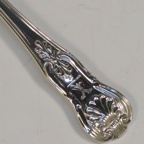 A large and handsome Antique Georgian Sterling Silver tea caddy spoon, having a double-struck Kings  pattern handle, and a plain shovel style bowl. This beautiful silver tea caddy spoon was made by William Eley of London in 1833. The dimensions of this fine hand-made antique silver tea caddy spoon are length 14 cms (5.5 inches), width across bowl 3.5 cms (1.3 inches), and it weighs approx. 14g (1 troy ounce).   