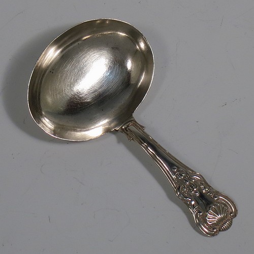 An Antique Georgian Sterling Silver tea caddy spoon, having a single-struck Kings Hour-Glass pattern handle, and a plain oval bowl. Made by Joseph Taylor of Birmingham in 1822. The dimensions of this fine hand-made antique silver tea caddy spoon are length 8.5 cms (3.3 inches), width across bowl 4.5 cms (1.75 inches), and it weighs approx. 11g (0.35 troy ounces).    