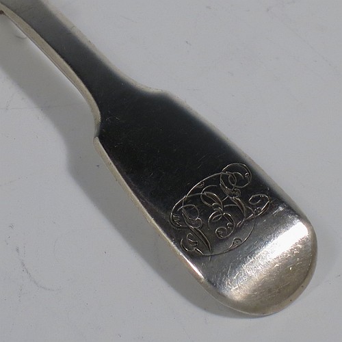 An Antique early Victorian Sterling Silver tea caddy spoon, having a plain Fiddle pattern handle, and a hand-chased fluted oval bowl. Made by William Elliott of London in 1843. The dimensions of this fine hand-made antique silver tea caddy spoon are length 10 cms (4 inches), width across bowl 3.5 cms (1.3 inches), and it weighs approx. 12g (0.38 troy ounces). Please note that this item is monogrammed.   