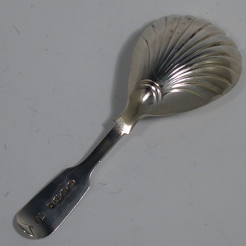 An Antique early Victorian Sterling Silver tea caddy spoon, having a plain Fiddle pattern handle, and a hand-chased fluted oval bowl. Made by William Elliott of London in 1843. The dimensions of this fine hand-made antique silver tea caddy spoon are length 10 cms (4 inches), width across bowl 3.5 cms (1.3 inches), and it weighs approx. 12g (0.38 troy ounces). Please note that this item is monogrammed.   