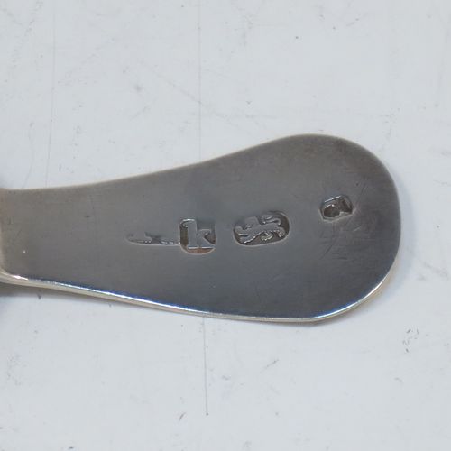 A very elegant Antique Georgian Sterling Silver tea caddy spoon, having an engraved curved handle, and a hand-chased shell style round bowl. Made in London in 1785, with the rare Incuse Duty Mark. The dimensions of this fine hand-made antique silver tea caddy spoon are length 7 cms (2.75 inches), width 4 cms (1.5 inches), and it weighs approx. 9g (0.3 troy ounces). Please note that this item is monogrammed.