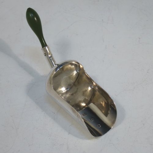 A rare and unusual Antique Georgian Sterling Silver tea caddy spoon, in a coal scuttle style with green stained bone handle. Made by Cocks and Bettridge of Birmingham in 1801. The dimensions of this fine hand-made antique silver tea caddy spoon are length 7 cms (2.75 inches), width 2 cms (0.75 inch), and it weighs approx. 7g (0.2 troy ounces).