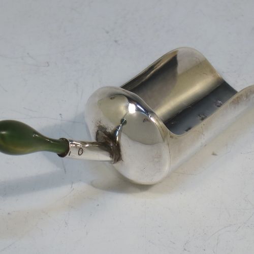 A rare and unusual Antique Georgian Sterling Silver tea caddy spoon, in a coal scuttle style with green stained bone handle. Made by Cocks and Bettridge of Birmingham in 1801. The dimensions of this fine hand-made antique silver tea caddy spoon are length 7 cms (2.75 inches), width 2 cms (0.75 inch), and it weighs approx. 7g (0.2 troy ounces).