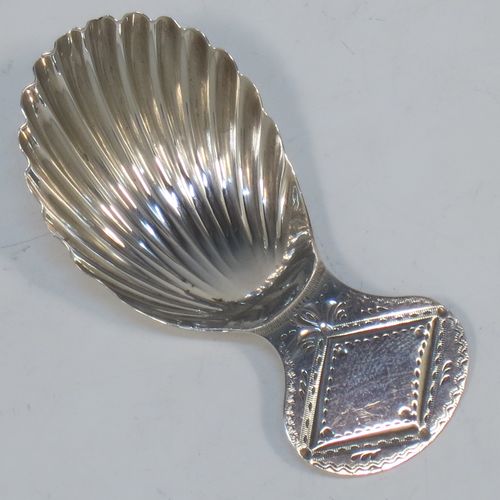 A very pretty Antique Georgian Sterling Silver tea caddy spoon, having an engraved flat handle, and a hand-chased shell style oval bowl. Made by Josiah Snatt of London in 1798. The dimensions of this fine hand-made antique silver tea caddy spoon are length 7 cms (2.75 inches), width 3.5 cms (1.3 inches), and it weighs approx. 9g (0.3 troy ounces). 