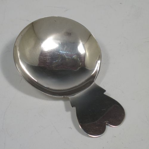 An Antique Georgian Sterling Silver tea caddy spoon, in a very plain style with a cut lobed handle, and a round bowl. Made by John Prichard of London in 1804. The dimensions of this fine hand-made antique silver tea caddy spoon are length 7 cms (2.75 inches), width across bowl 4.5 cms (1.75 inches), and it weighs approx. 9g (0.3 troy ounces).    