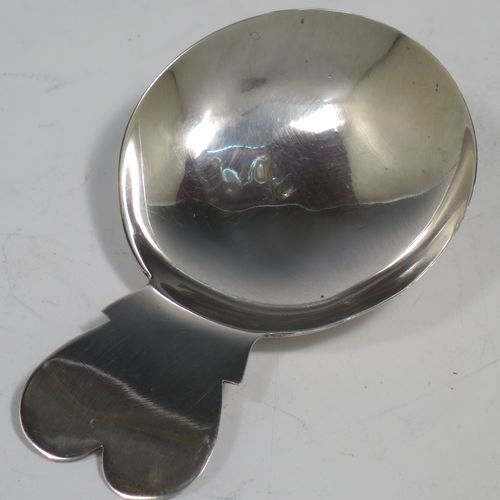 An Antique Georgian Sterling Silver tea caddy spoon, in a very plain style with a cut lobed handle, and a round bowl. Made by John Prichard of London in 1804. The dimensions of this fine hand-made antique silver tea caddy spoon are length 7 cms (2.75 inches), width across bowl 4.5 cms (1.75 inches), and it weighs approx. 9g (0.3 troy ounces).    