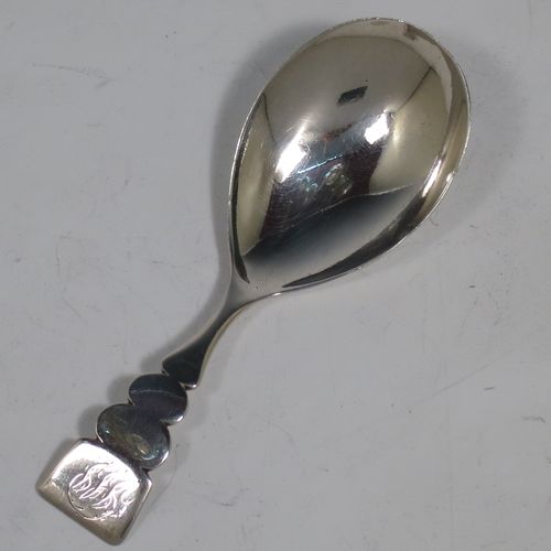 An Antique Georgian Sterling Silver tea caddy spoon, in a very plain style with a cut lobed handle, and an oval bowl. Made by Thomas James of London in 1808. The dimensions of this fine hand-made antique silver tea caddy spoon are length 9 cms (3.5 inches), width across bowl 3 cms (1.25 inches), and it weighs approx. 13g (0.4 troy ounces).    