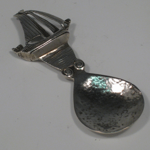 Sterling silver Arts & Crafts style tea caddy spoon with a Galleon finial, made in Edinburgh in 1938 Length 9.5 cms (3.75 inches). Weight approx. 1 troy ounce (31g).