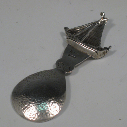 Sterling silver Arts & Crafts style tea caddy spoon with a Galleon finial, made in Edinburgh in 1938 Length 9.5 cms (3.75 inches). Weight approx. 1 troy ounce (31g).