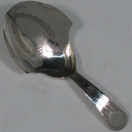 Antique Georgian sterling silver tea caddy spoon, having an engraved curved handle, and an engraved and bowl, with floral decoration. Made by Joseph Taylor of Birmingham in 1802. The dimensions of this fine hand-made silver tea caddy spoon are length 8 cms (3 inches), width 3.5 cms (1.3 inches), and it weighs approx. 6g (0.2 troy ounces).    