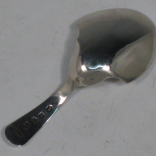 Antique Georgian sterling silver tea caddy spoon, having an engraved curved handle, and an engraved and bowl, with floral decoration. Made by Joseph Taylor of Birmingham in 1802. The dimensions of this fine hand-made silver tea caddy spoon are length 8 cms (3 inches), width 3.5 cms (1.3 inches), and it weighs approx. 6g (0.2 troy ounces).    