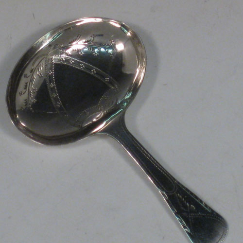 Antique Georgian sterling silver tea caddy spoon, having an engraved flat handle, and an engraved oval bowl, with floral decoration. Made by Joseph Taylor of Birmingham in 1800. The dimensions of this fine hand-made silver tea caddy spoon are length 7.5 cms (3 inches), width 4.5 cms (1.75 inches), and it weighs approx. 7g (0.2 troy ounces).    