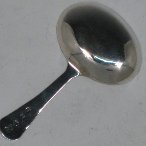 Antique Georgian sterling silver tea caddy spoon, having an engraved flat handle, and an engraved oval bowl, with floral decoration. Made by Joseph Taylor of Birmingham in 1800. The dimensions of this fine hand-made silver tea caddy spoon are length 7.5 cms (3 inches), width 4.5 cms (1.75 inches), and it weighs approx. 7g (0.2 troy ounces).    