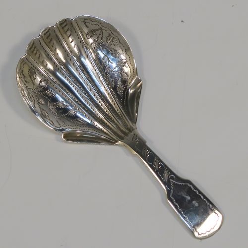 A very pretty Antique Victorian Sterling Silver tea caddy spoon, having a hand-engraved floral and stipple decoration, and a hand-chased shell style bowl. This elegant antique silver tea caddy spoon was made by James Collins of Birmingham in 1845. The dimensions of this fine hand-made antique silver tea caddy spoon are length 8.5 cms (3.3 inches), width 4 cms (1.5 inches), and it weighs approx. 6g (0.2 troy ounces).   