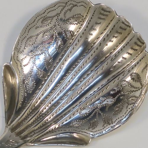 A very pretty Antique Victorian Sterling Silver tea caddy spoon, having a hand-engraved floral and stipple decoration, and a hand-chased shell style bowl. This elegant antique silver tea caddy spoon was made by James Collins of Birmingham in 1845. The dimensions of this fine hand-made antique silver tea caddy spoon are length 8.5 cms (3.3 inches), width 4 cms (1.5 inches), and it weighs approx. 6g (0.2 troy ounces).   