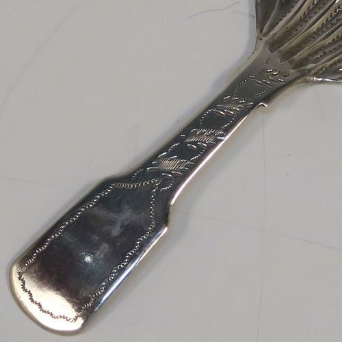 A very pretty Antique Victorian Sterling Silver tea caddy spoon, having a hand-engraved floral and stipple decoration, and a hand-chased shell style bowl. This elegant antique silver tea caddy spoon was made by James Collins of Birmingham in 1845. The dimensions of this fine hand-made antique silver tea caddy spoon are length 8.5 cms (3.3 inches), width 4 cms (1.5 inches), and it weighs approx. 6g (0.2 troy ounces).   