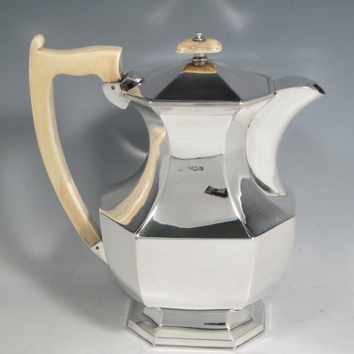 Sterling silver Art Deco tea and coffee service, consisting of Teapot, Coffee pot, sugar bowl, cream jug, and tea tray. Having plain octagonal bodies, with bone handles and finials, and sitting on pedestal feet, displayed on an original octagonal tea tray with matching handles. All made by Emile Viner of Sheffield in 1938. The dimensions of this fine hand-made silver tea and coffee service are length of tray 53.5 cms (21 inches), width 12.75 inches (32.5 cms), height of coffee pot 20 cms (8 inches), and with a total weight of approx. 3,500g (113 troy ounces).