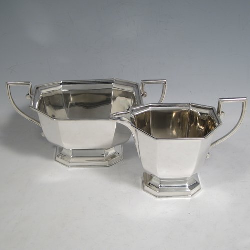 Sterling silver Art Deco tea and coffee service, consisting of Teapot, Coffee pot, sugar bowl, cream jug, and tea tray. Having plain octagonal bodies, with bone handles and finials, and sitting on pedestal feet, displayed on an original octagonal tea tray with matching handles. All made by Emile Viner of Sheffield in 1938. The dimensions of this fine hand-made silver tea and coffee service are length of tray 53.5 cms (21 inches), width 12.75 inches (32.5 cms), height of coffee pot 20 cms (8 inches), and with a total weight of approx. 3,500g (113 troy ounces).