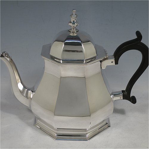 A handsome Sterling Silver Art Deco style four-piece tea and coffee service, having plain octagonal panelled and bellied bodies, with black wooden handles and cast finials, domed lids with hinges, and sitting on hexagonal pedestal feet. This elegant and stylish silver tea and coffee set was made by Roberts & Belk Sheffield in 1930. The dimensions of this fine hand-made tea and coffee service are length of teapot 24 cms (9.5 inches), height of coffee pot 23 cms (9 inches), and the total weight is approx. 1,925g (62 troy ounces).    