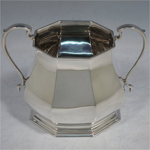 A handsome Sterling Silver Art Deco style four-piece tea and coffee service, having plain octagonal panelled and bellied bodies, with black wooden handles and cast finials, domed lids with hinges, and sitting on hexagonal pedestal feet. This elegant and stylish silver tea and coffee set was made by Roberts & Belk Sheffield in 1930. The dimensions of this fine hand-made tea and coffee service are length of teapot 24 cms (9.5 inches), height of coffee pot 23 cms (9 inches), and the total weight is approx. 1,925g (62 troy ounces).    