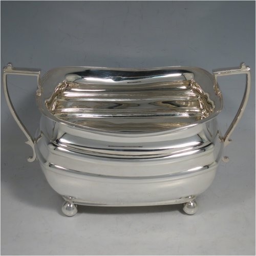 A Sterling Silver four-piece tea and coffee set, having plain rectangular baluster bodies with rounded corners and reeded borders, with wooden handles and finials, and all sitting on four ball feet. Made by James Dixon & Sons of Sheffield in 1927. The dimensions of this fine hand-made silver tea and coffee service are length of teapot 29 cms (11.5 inches), height of coffee pot pot 24 cms (9.5 inches), and the total weight is approx. 1,842g (59 troy ounces).   