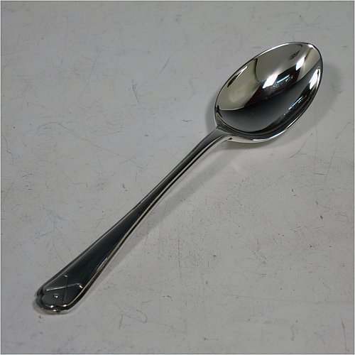 A Sterling Silver set of six tea or coffee spoons, having plain oval bowls, handles with reeded borders, and having crossed golf clubs and ball motifs on the ends, all in their original cream satin and black velvet-lined presentation box. Made by Walker & Hall of Sheffield in 1933. The dimensions of this fine hand-made set of teaspoons or coffee spoons are length of each spoon 11 cms (4.3 inches), and the total weight is approx. 78g (2.5 troy ounces).    