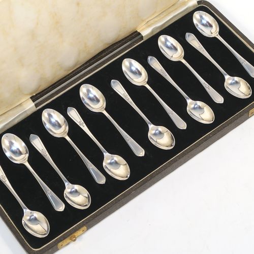 An elegant Antique Sterling Silver set of twelve teaspoons or coffee spoons, having plain oval bowls, and handles with a single-struck floral pattern, all in a cream satin and black velvet-lined presentation box. These pretty silver spoons were made by Allen and Darwin of Sheffield in 1912. The dimensions of this fine hand-made set of coffee spoons or teaspoons are length of each spoon 10 cms (4 inches), and the total weight is approx. 94g (3 troy ounce).   