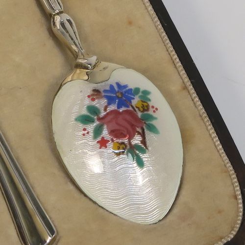 An extremely pretty Antique Sterling Silver and enamelled set of six tea or coffee spoons, having hand-painted and enamelled spoon backs in a floral design, all in their original cream satin and velvet-line presentation box. These beautiful antique silver and enamelled spoons were made by Turner and Simpson of Birmingham in 1915. The dimensions of this fine hand-made set of silver and enamelled teaspoons or coffee spoons are length of each spoon 10 cms (4 inches), and the total weight is approx. 66g (2.1 troy ounces). Please note that the enamel is in perfect order which is rare to find in spoons of this age.  